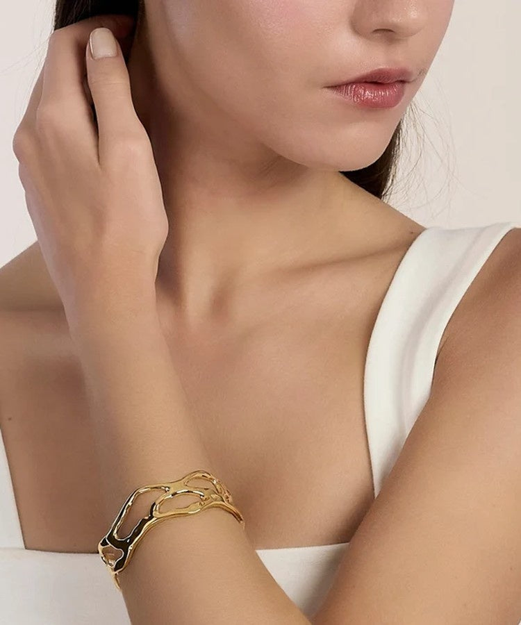 Pulseira cuff em aço dourado Kidult