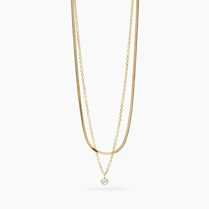 Choker dourado com correntes e cristal
