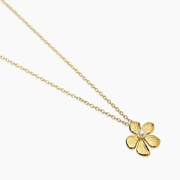 Colar choker com flor em aço dourado martelado