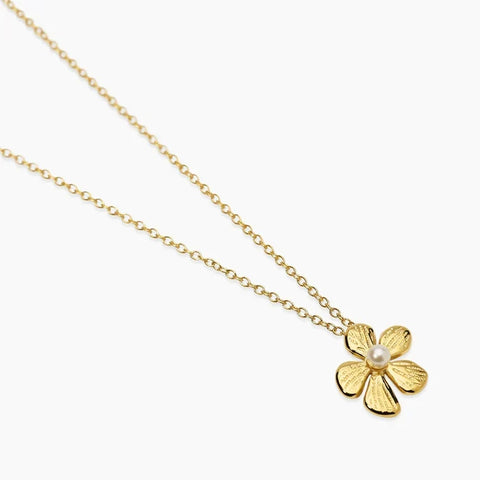 Colar choker com flor em aço dourado martelado