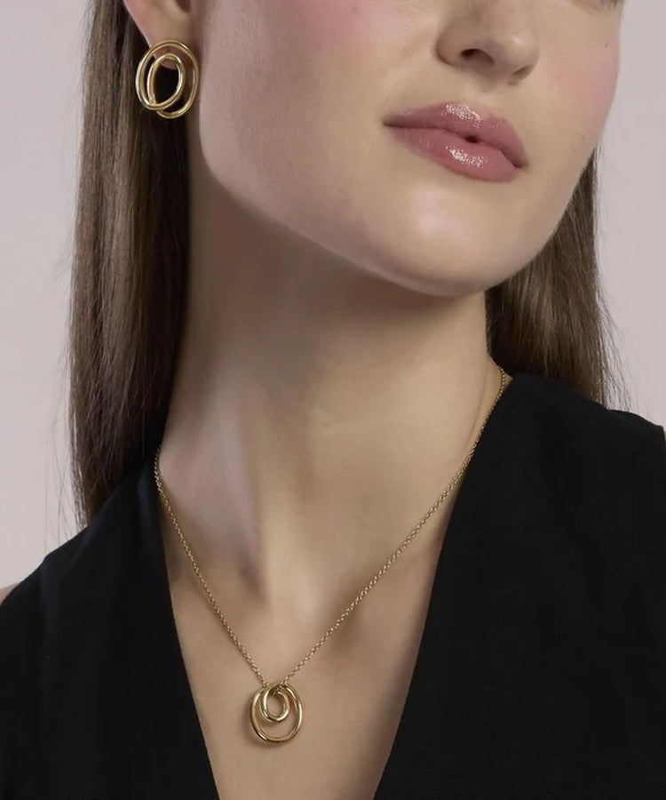 Brincos em espiral em aço dourado